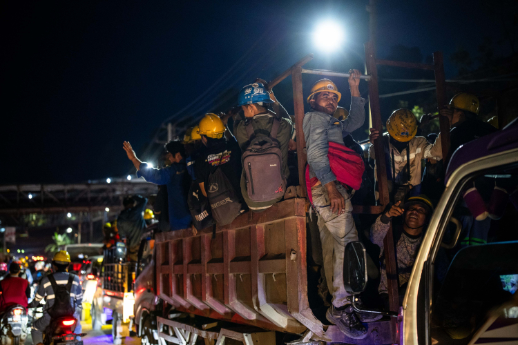 Employees in traffic during the working shift change near Indonesia Morowali Industrial Park (IMIP) on June 10, 2024 in Morowali, Central Sulawesi, Indonesia.