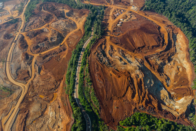 Excavators gather soil containing nickel ore at a mining site operated by PT Hengjaya Mineralindo on October 26, 2023 in Morowali, Central Sulawesi, Indonesia.