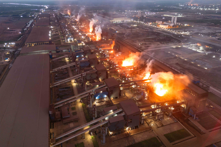 The belching chimneys of PT Obsidian Stainless Steel, a nickel processing complex in Konawe Regency, Central Sulawesi, Indonesia on October 28, 2023. The industrial are powering the move to electric vehicles.