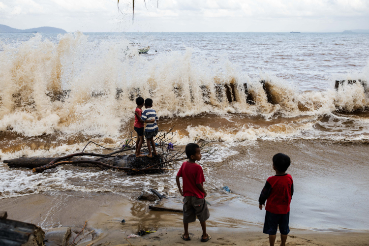 The children play in the sea waters contaminated by nickel mines at Mandiodo village near the nickel mining site on June 9, 2024, in North Konawe, Southeast Sulawesi, Indonesia.