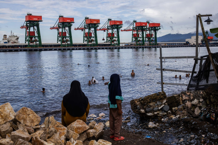 The children play in the sea waters contaminated by nickel mines at Labota village on June 12, 2024, in North Konawe, Southeast Sulawesi, Indonesia.